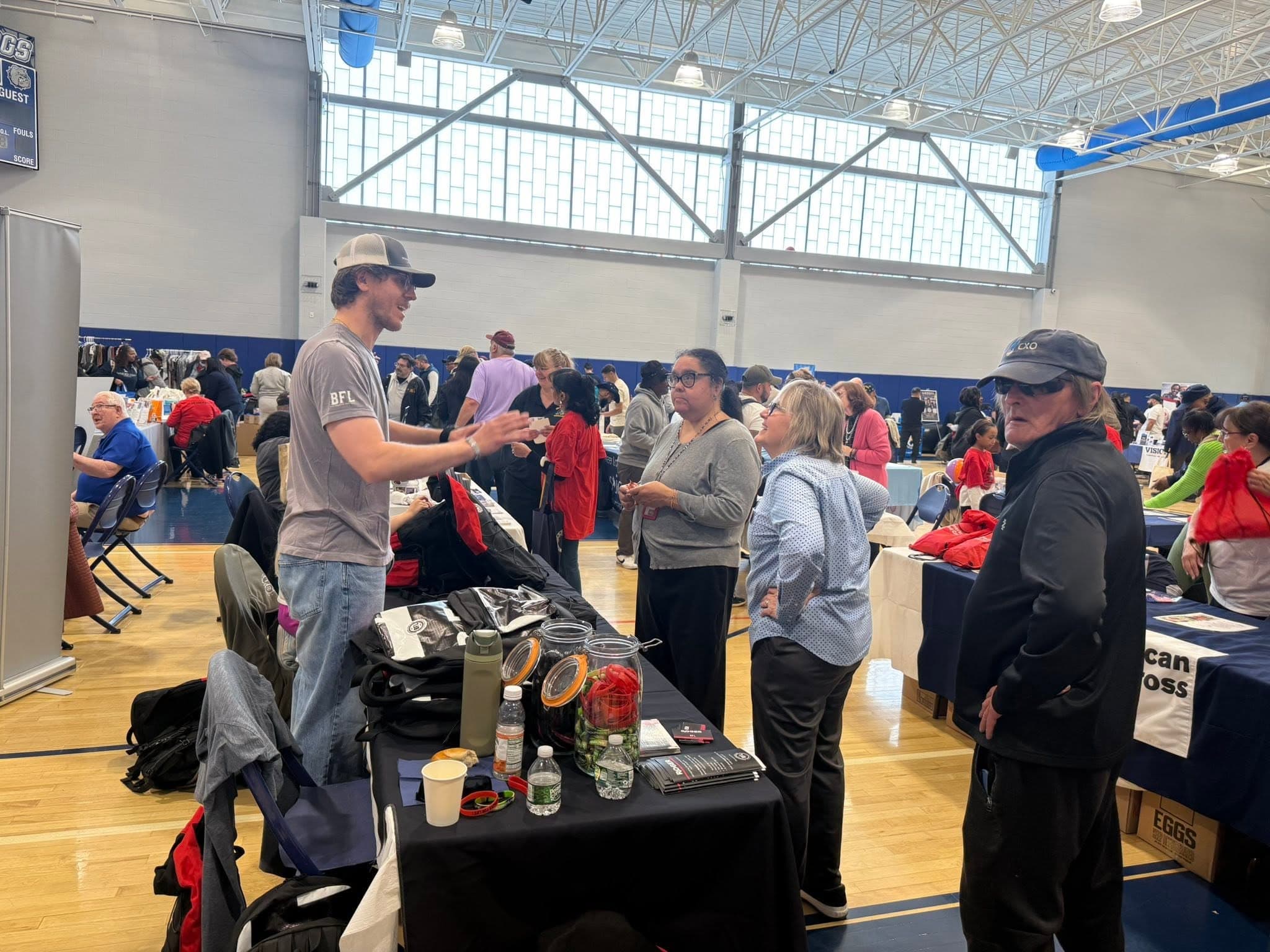 Community partners staffing tables at the Veterans Stand Down