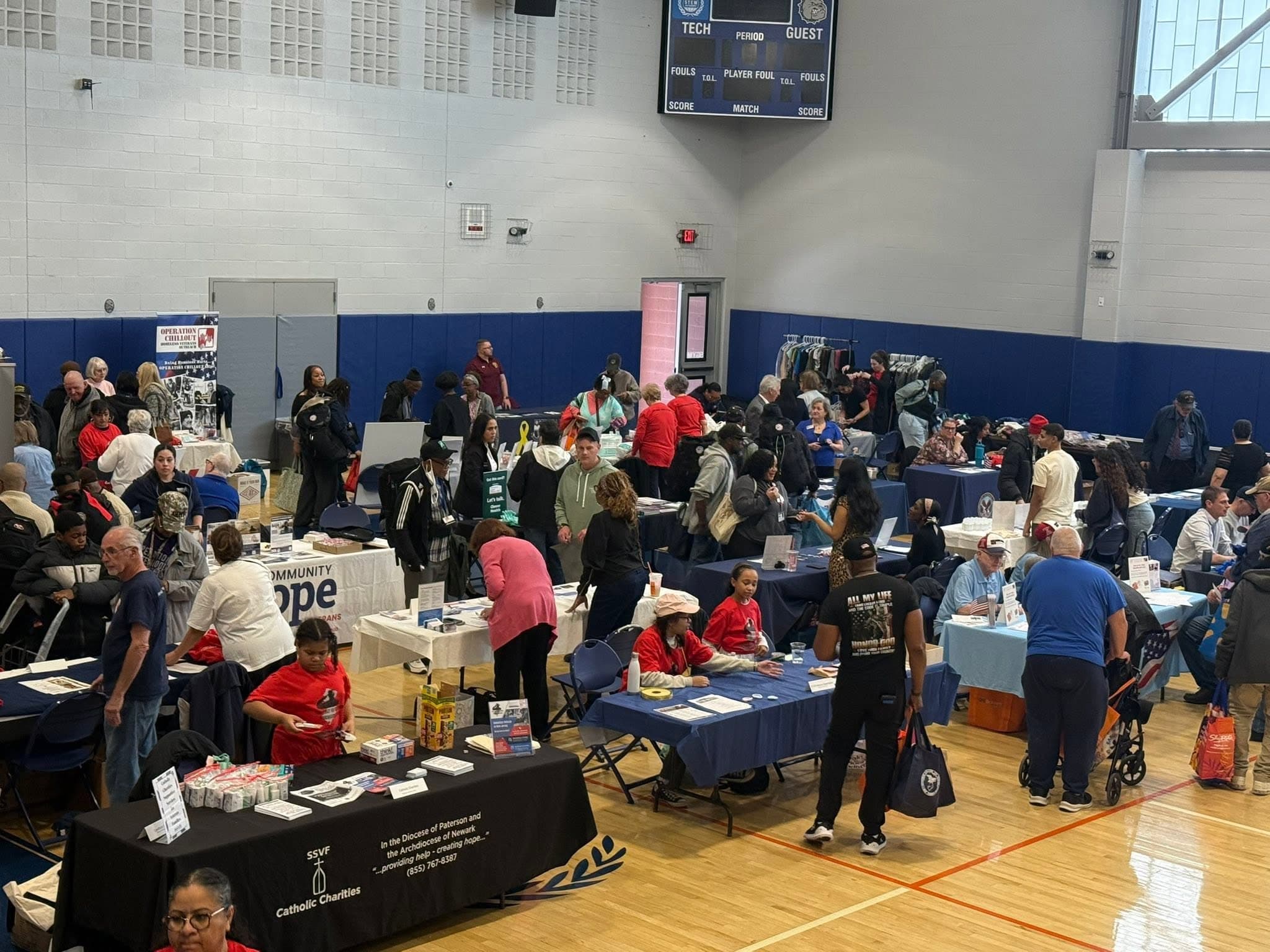 Attendees visiting resource tables at the Stand Down