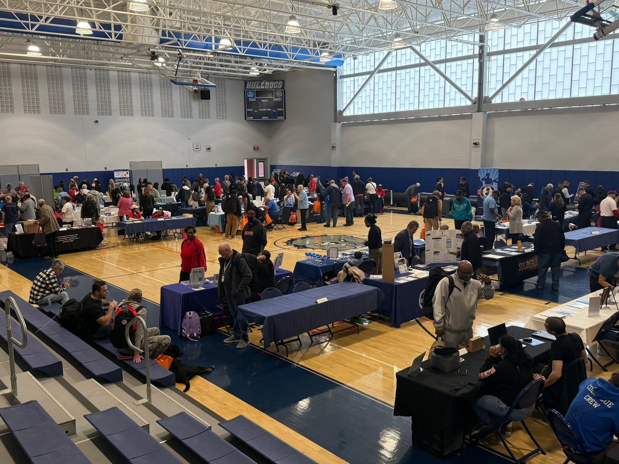 Resource providers assisting attendees at the Wayne event
