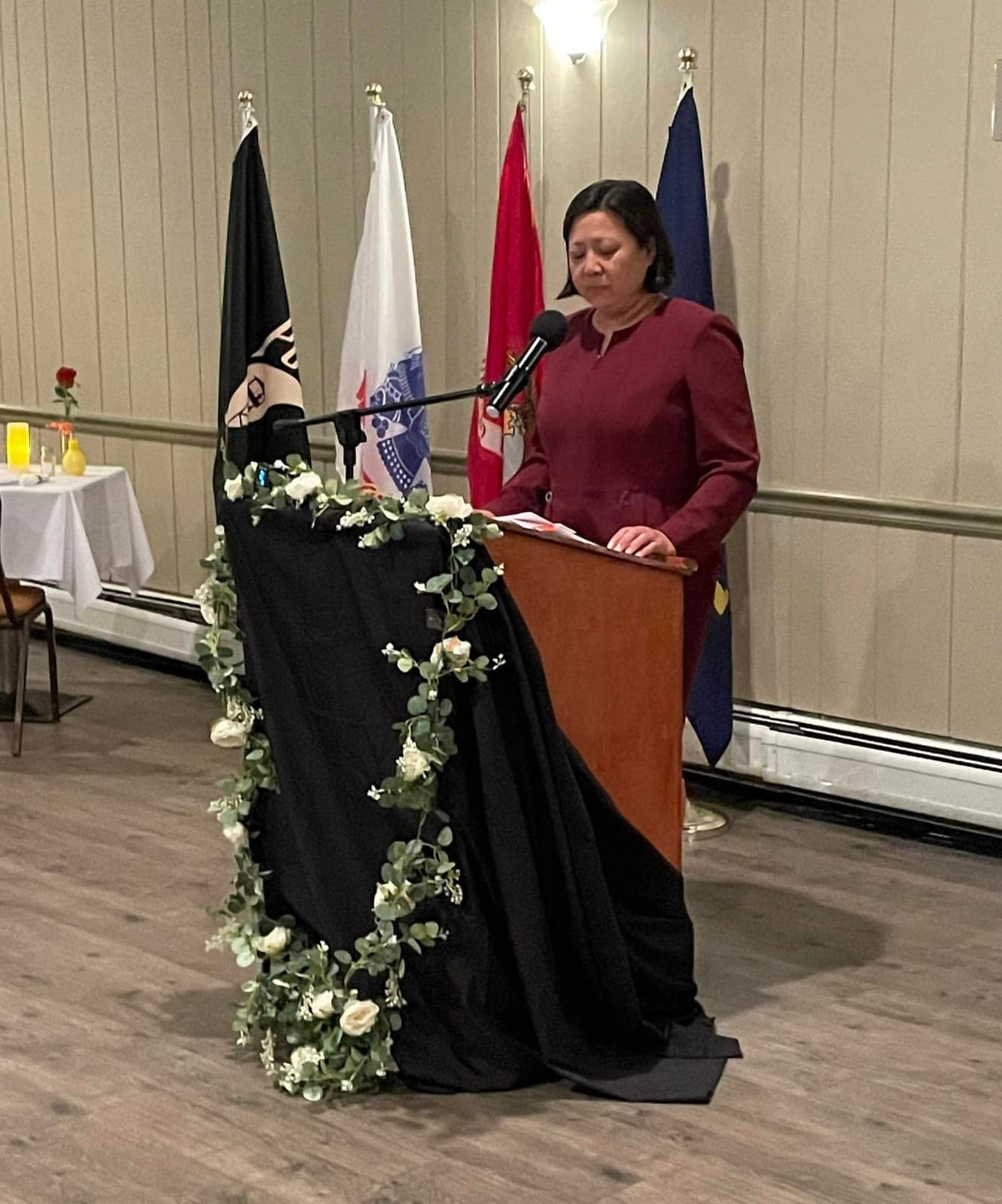 A speaker addressing attendees from the podium