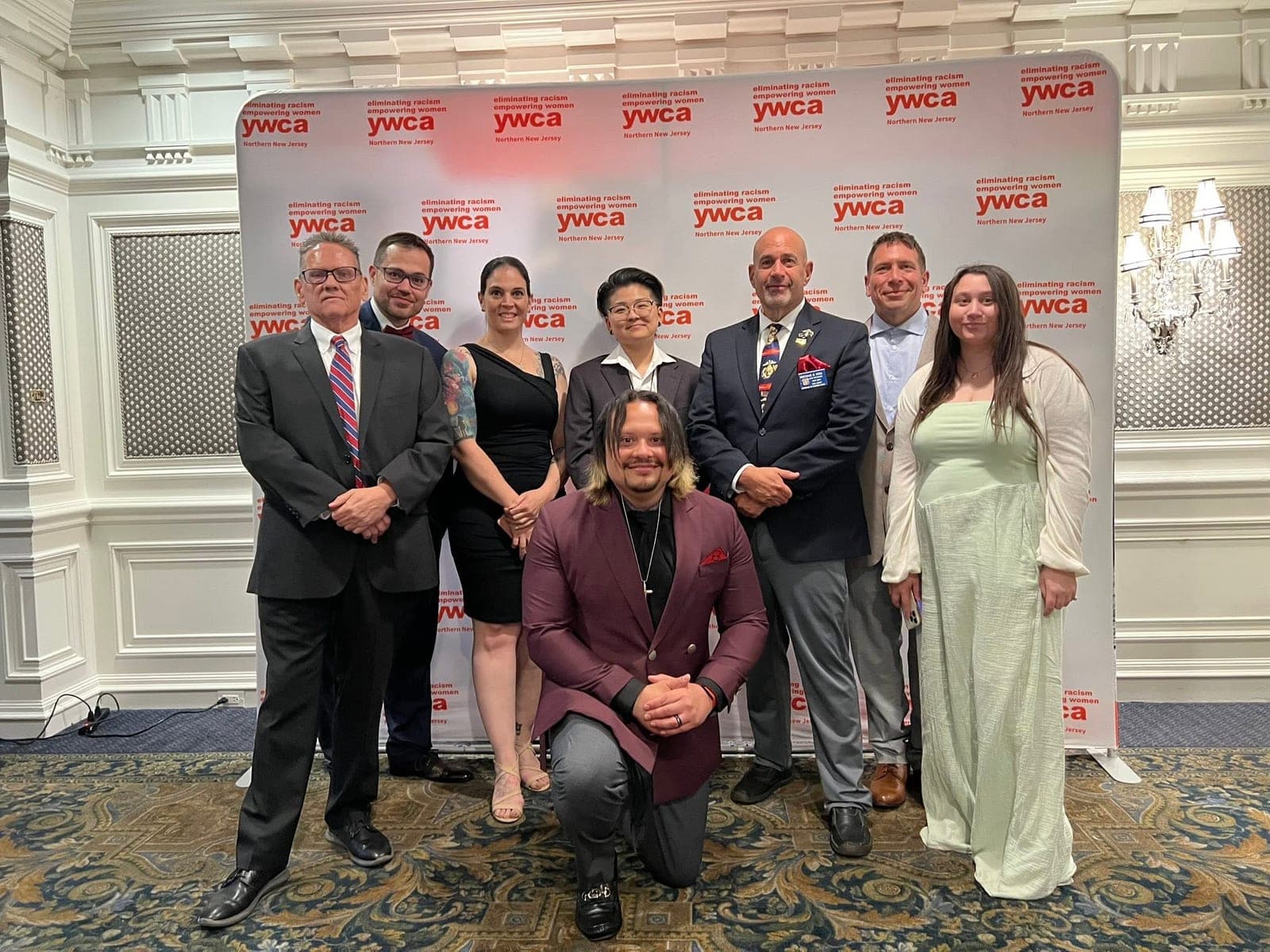 Organizers and partners at the event banner