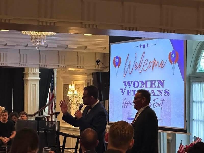 Welcome screen reading Women Veterans on stage