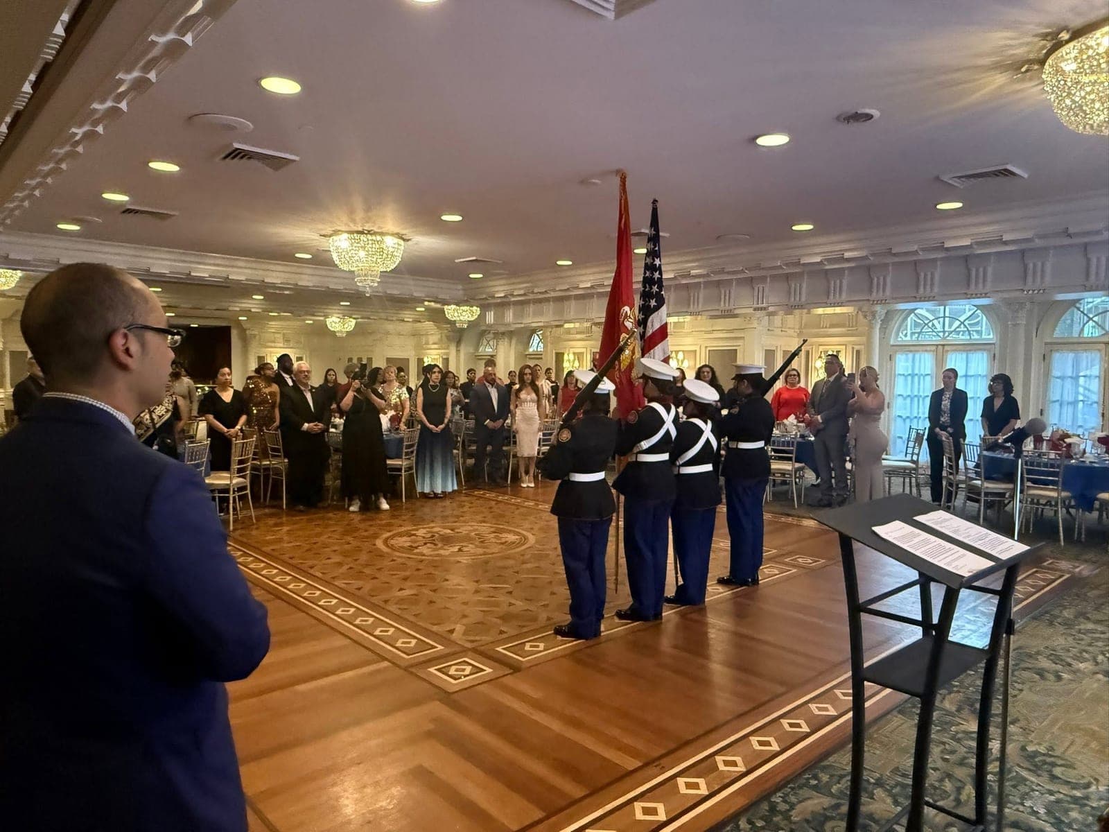 A Marine Corps color guard presenting the colors in the ballroom
