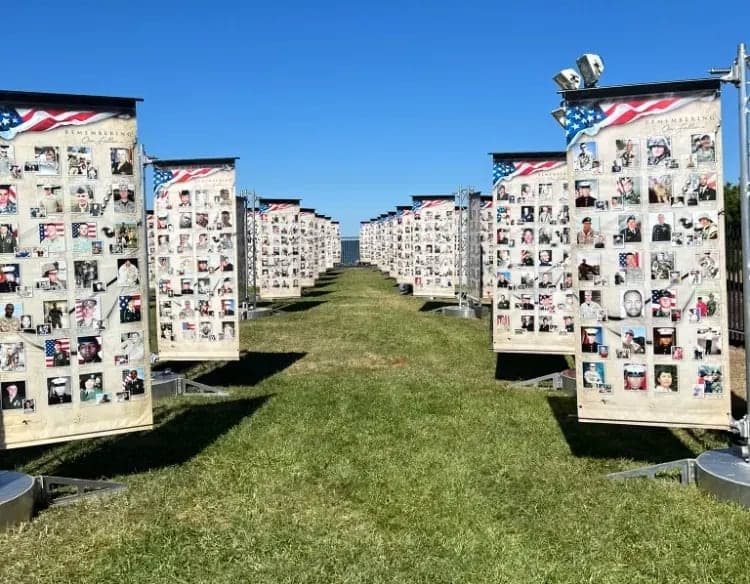 Rows of Remembering Our Fallen memorial banners on display